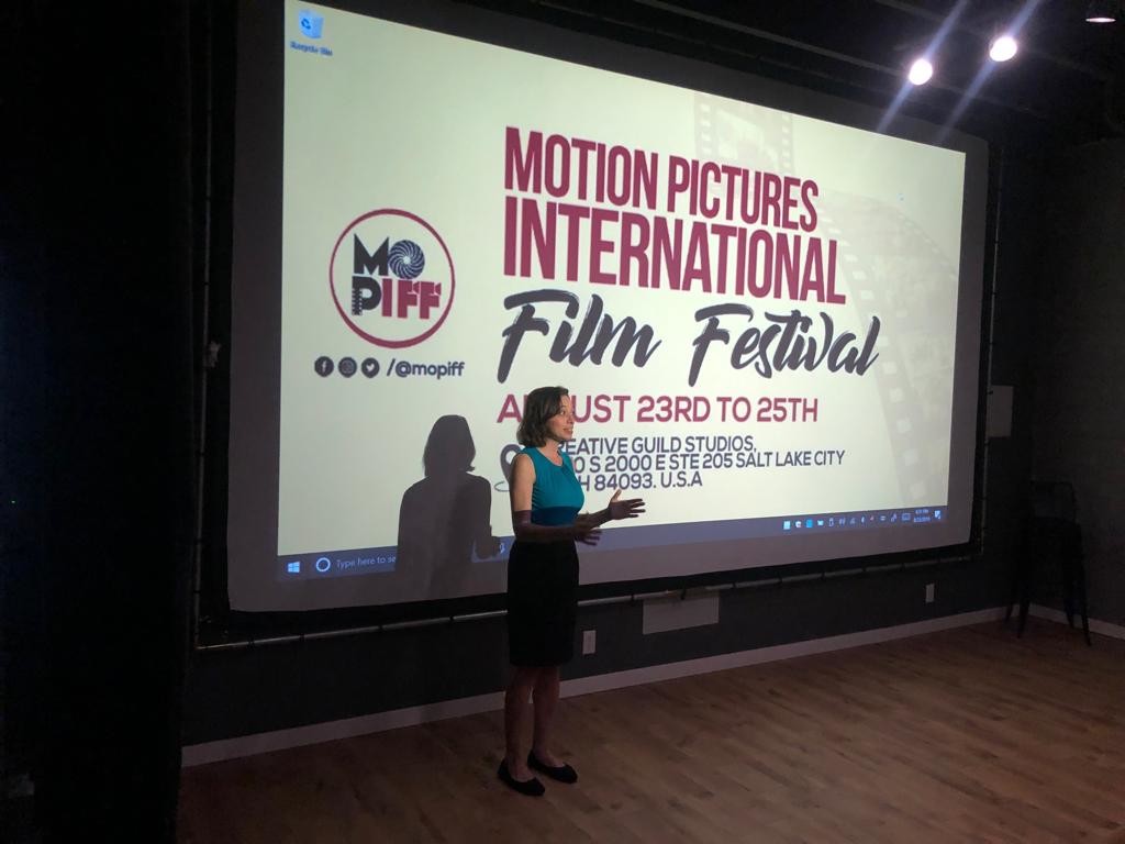 Tourist taking photo of a building