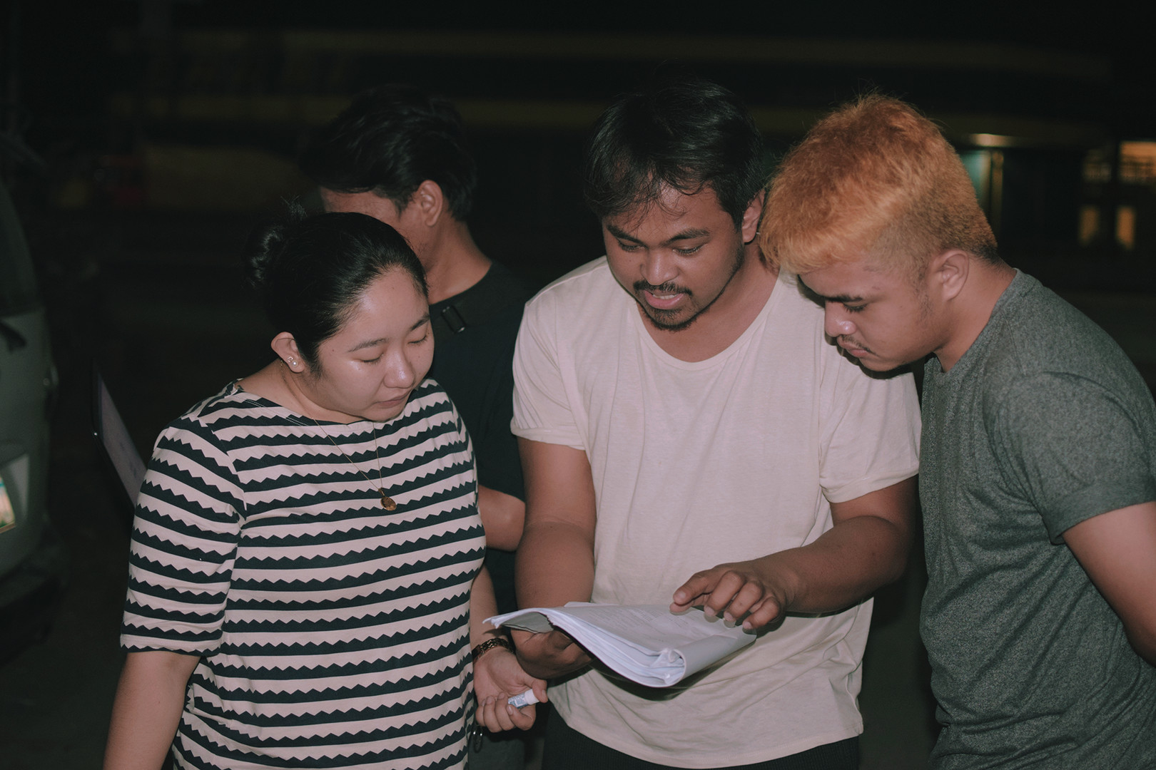 Actors with the director reading script